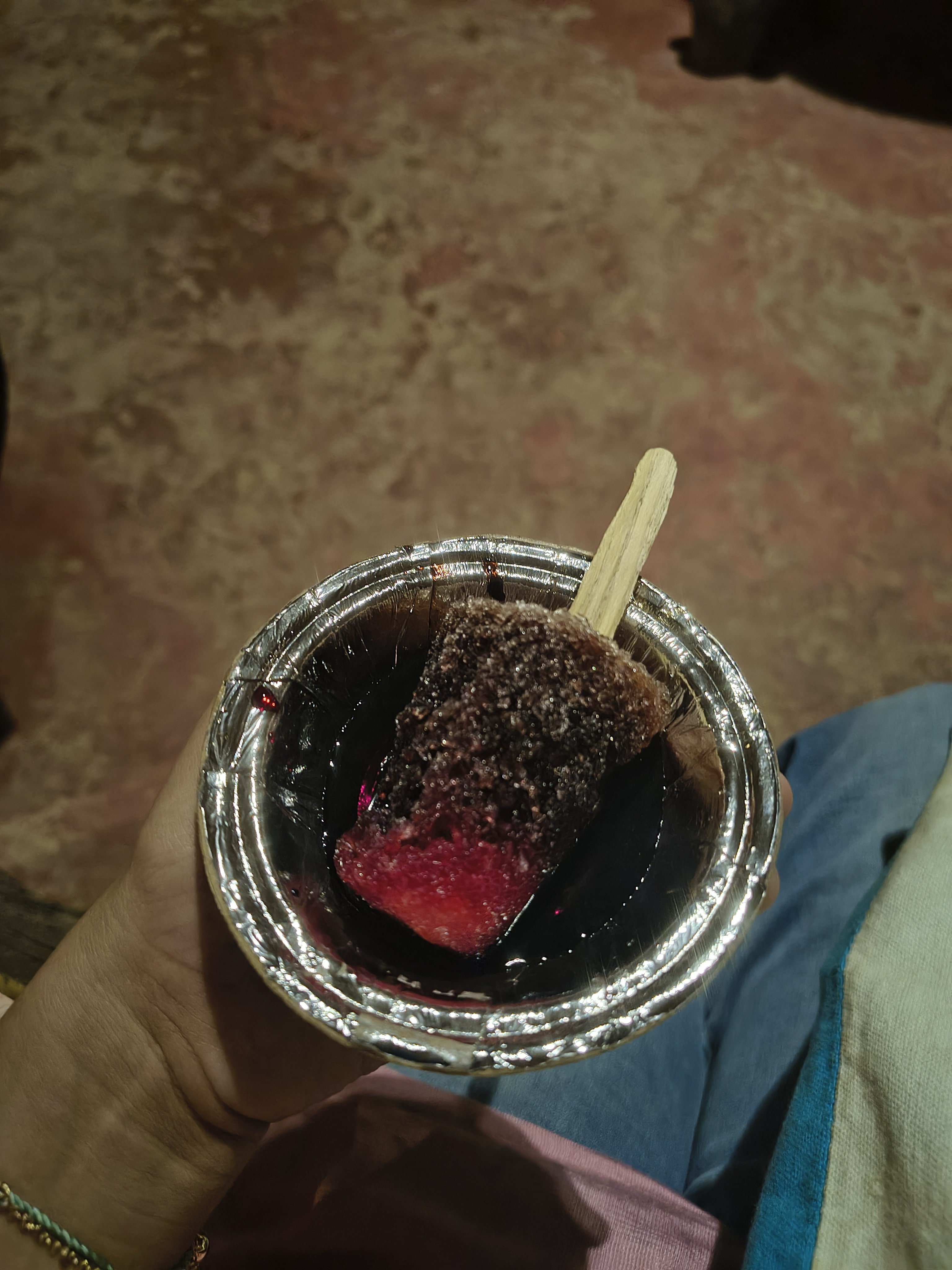 Enjoying ice gola at Chokhi Dhan